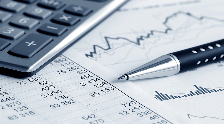 Image of calculator, pen, charts and documents.