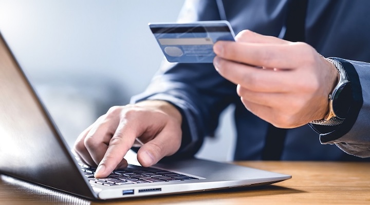 a person uses credit card for online shopping
