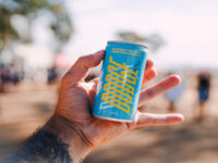 Image of person holding Drink Dodge can.