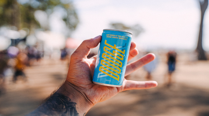 Image of person holding Drink Dodge can.