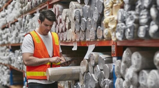Image of worker examining product
