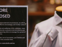 Shop sign announcing closure due to covid pandemic.