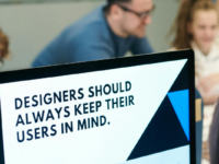 Computer with text on screen reading "designers should always keep their users in mind".