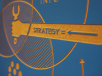 An engraved blue and yellow diagram with an arrow reading strategy.