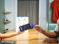 Man paying by card at shop