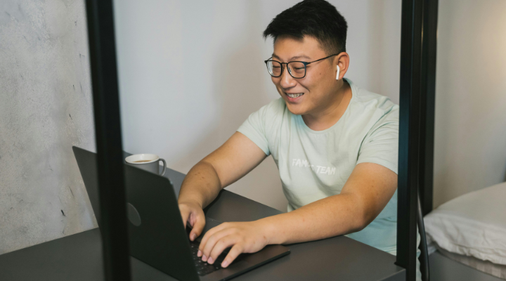 Man typing on laptop