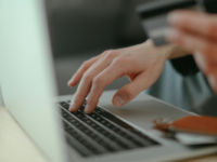 Person using card to shop online