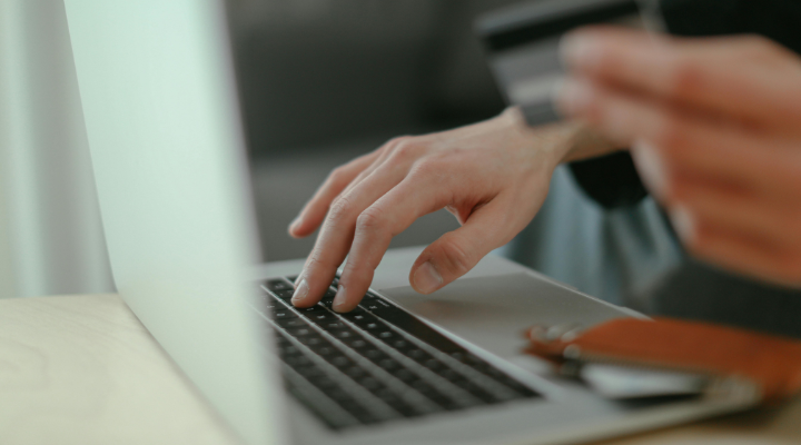 Person using card to shop online