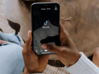 Person opening TikTok on phone