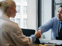Man and woman shaking hands on a business agreement