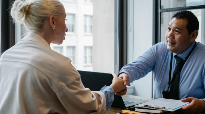 Man and woman shaking hands on a business agreement