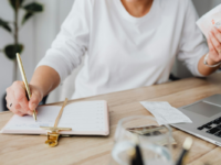 Woman doing taxes at desk