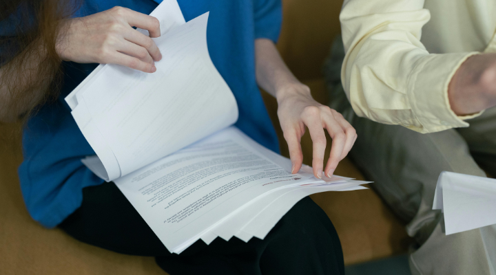 Working leafing through paperwork